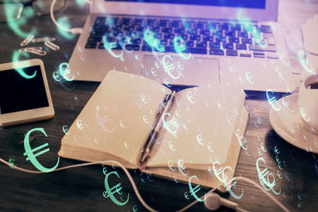 Multi exposure of financial graph drawings and desk with open notebook background. Concept of forexの写真素材