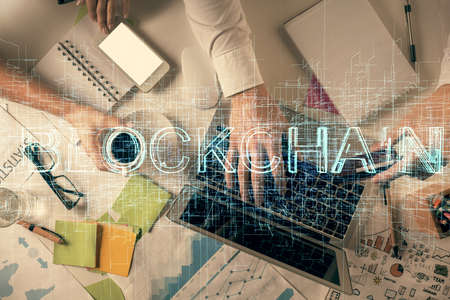 Double exposure of man and woman working together and crypto theme hologram drawing. Computer...