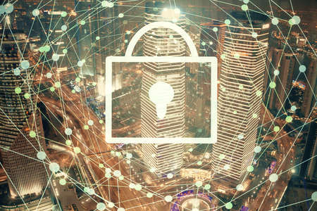 Lock icon hologram on city view with skyscrapers background multi exposure. Data security concept.
