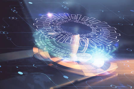 Double exposure of desktop computer and technology theme hologram. Concept of software development.