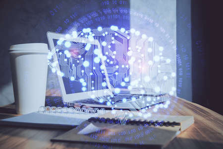 Multi exposure of work space with computer and human brain hologram. Brainstorm concept.