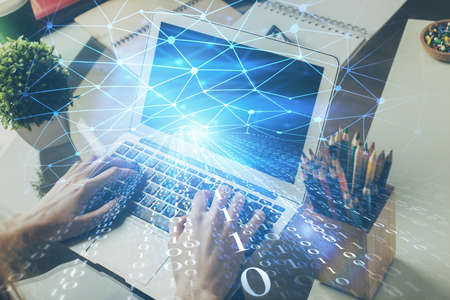 Multi exposure of technology hologram with man working on computer background. Concept of big data.の写真素材
