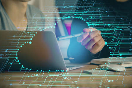 Multi exposure of data internet theme hologram with man working on computer on background. Concept...