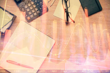 Double exposure of forex graph drawing and work table top veiw. Concept of financial analysis.