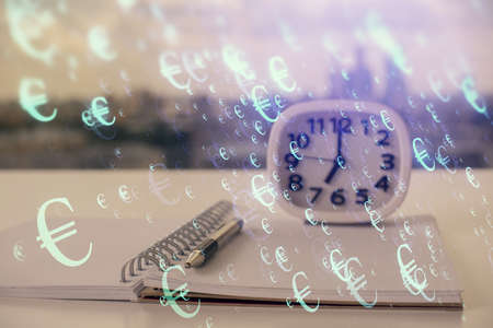 Double exposure of financial graph drawings and desk with open notebook background. Concept of forex marketの写真素材