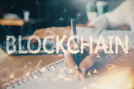 Double exposure of blockchain theme drawing over people taking notes background. Concept of cryptocurrencyの写真素材