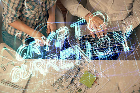 Double exposure of man and woman working together and crypto theme hologram drawing. Computer...