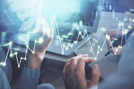 Double exposure of man and woman working together and forex chart hologram. Business concept....