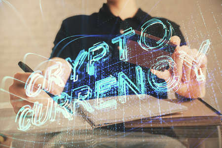 Double exposure of man hands holding a credit card and crypto business theme drawing. Digital...