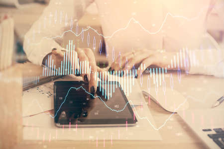 Double exposure of forex chart sketch hologram and woman holding and using a mobile device....