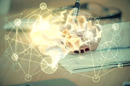 Multi exposure of womans writing hand on background with brain hologram. Concept of brainstorming.
