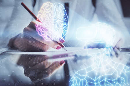 AR hologram over hands taking notes background. Concept of augmented reality. Double exposureの写真素材