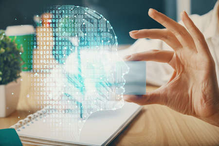 Multi exposure of writing hand on background with brain hologram. Concept of learning.
