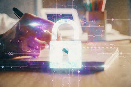 Double exposure of womans hands writing with lock icon. Concept of security and protection of data