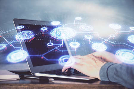 Social network theme hologram with businessman working on computer on background. Concept of world...
