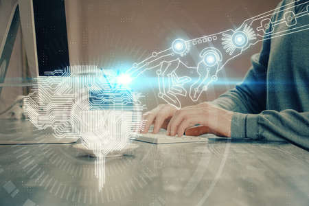 Man with computer background with brain theme hologram. Concept of brainstorm. Double exposure.
