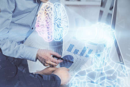 AR hologram with man working on computer on background. Augmented reality concept. Double exposure.の写真素材