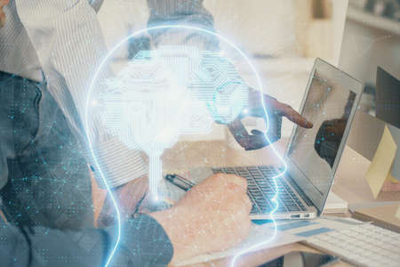 Man with computer background with brain theme hologram. Concept of brainstorm. Double exposure.