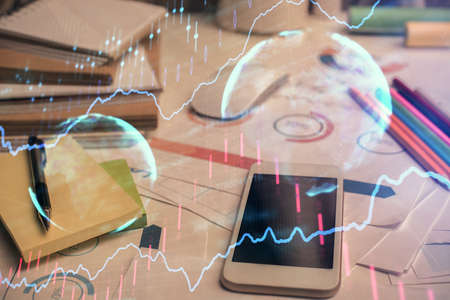 Double exposure of forex chart drawing and cell phone background. Concept of financial data analysis