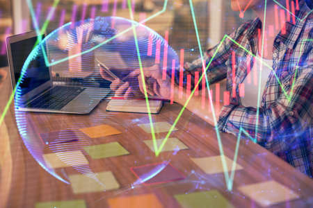 Double exposure of businesswoman hands typing on computer and forex graph hologram drawing. Financial analysis concept.の写真素材