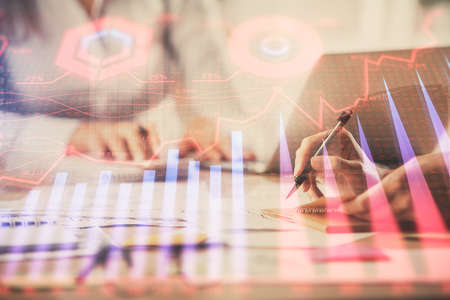Multi exposure of woman hands typing on computer and forex chart hologram drawing. Stock market analysis concept.の写真素材