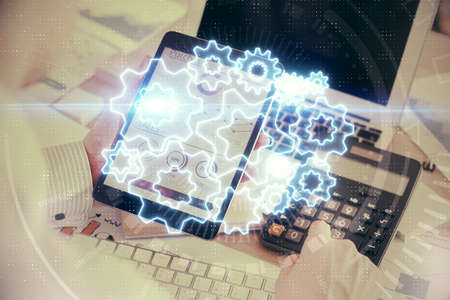 Double exposure of mans hands holding and using a phone and international business theme drawing.