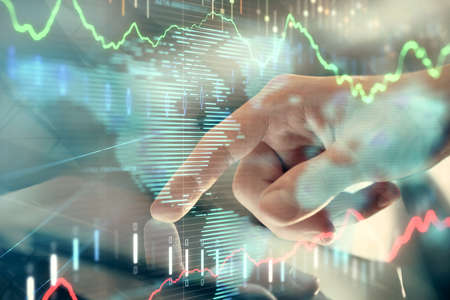 Multi exposure of mans hands holding and using a phone and financial chart drawing. Market analysis...