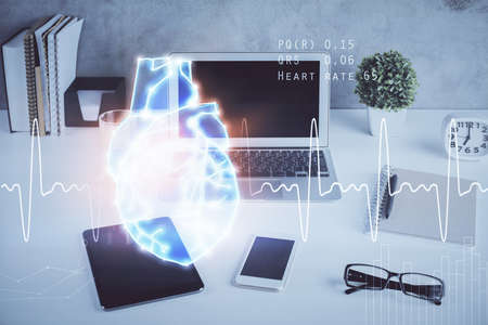 Desktop computer background and heart drawing. Double exposure. Medical study and healthcare concept.の写真素材
