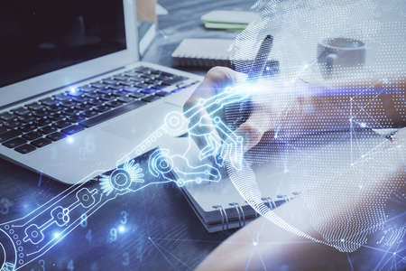 Tech theme hologram over womans hands taking notes background. Concept of hightech. Double exposure