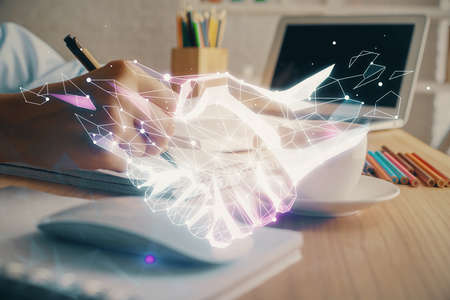 Handshake drawing over hands taking notes background. Concept of success. Double exposureの写真素材