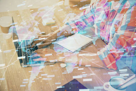 Businessman with computer background with technology theme hologram. Concept of big data. Double exposure.の写真素材