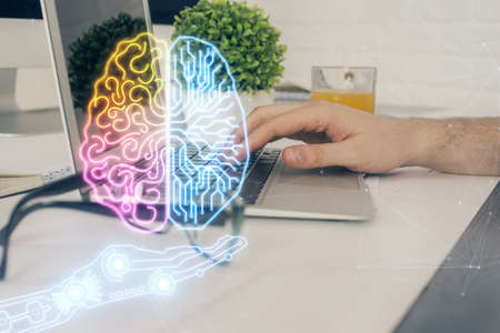 Man with computer background with brain theme hologram. Concept of brainstorm. Double exposure.の写真素材