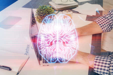 Man with computer background with brain theme hologram. Concept of brainstorm. Double exposure.の写真素材