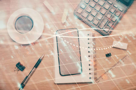 Multi exposure of forex graph hologram over desktop with phone. Top view. Mobile trade platform concept.の写真素材