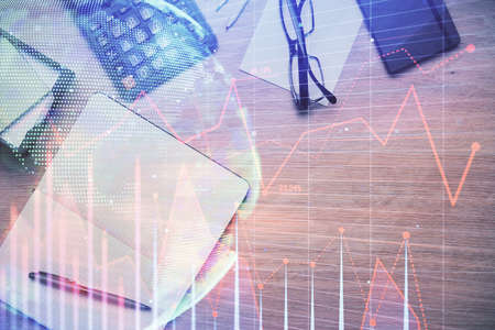Double exposure of forex graph drawing and work table top veiw. Concept of financial analysis.