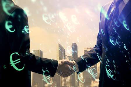 Double exposure of forex graph hologram and handshake of two men. Stock market concept.