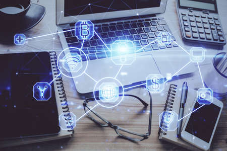 Computer on desktop with social network hologram. Double exposure. Concept of international people...