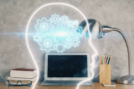 Double exposure of desktop computer and human brain drawing hologram. Ai concept.