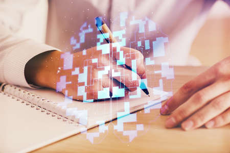 Writing mans hands background with technology drawings. Double exposure. Concept of innovation.