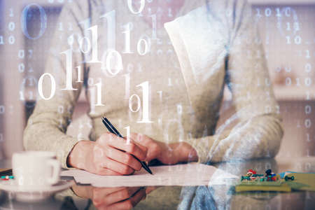 Double exposure of writing hand on background with data solution technology hologram. Ai concept.の写真素材