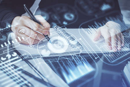 Tech theme hologram over womans hands taking notes background. Concept of hightech. Double exposure
