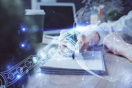 Tech theme hologram over womans hands taking notes background. Concept of hightech. Double exposure