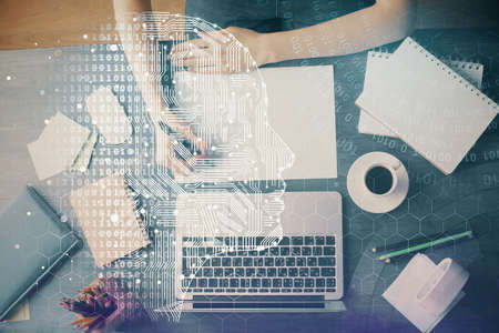 Multi exposure of writing hand on background with brain hologram. Concept of learning.
