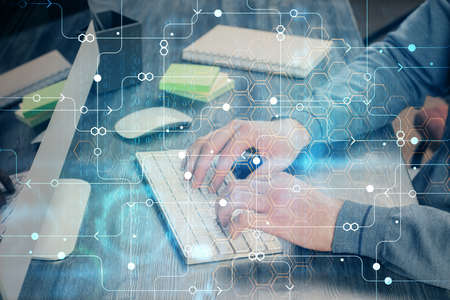 Double exposure of technology hologram with man working on computer background. Concept of big data.