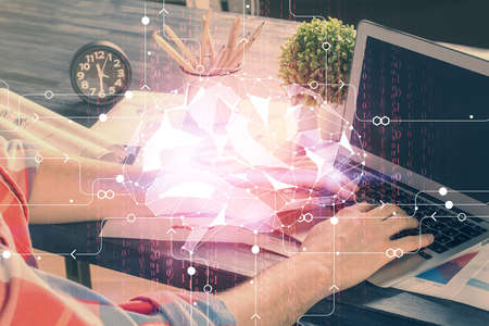 Man with computer background with brain theme hologram. Concept of brainstorm. Double exposure.