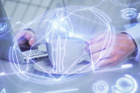 Science hologram with man working on computer on background. Concept of study. Double exposure.