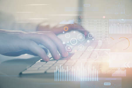 Double exposure of data internet theme hologram with man working on computer on background. Concept...