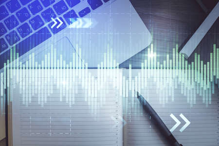 Stock market graph and top view computer on the table background. Multi exposure. Concept of...