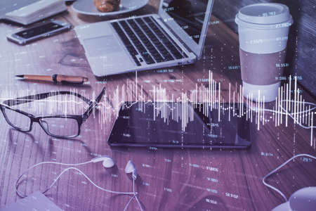 Double exposure of forex chart drawing and cell phone background. Concept of financial trading