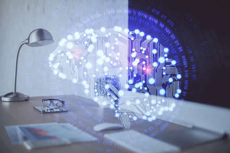 Double exposure of work space with computer and human brain drawing hologram. Brainstorm concept.